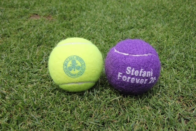Stefani Forever 20 purple tennis ball on grass